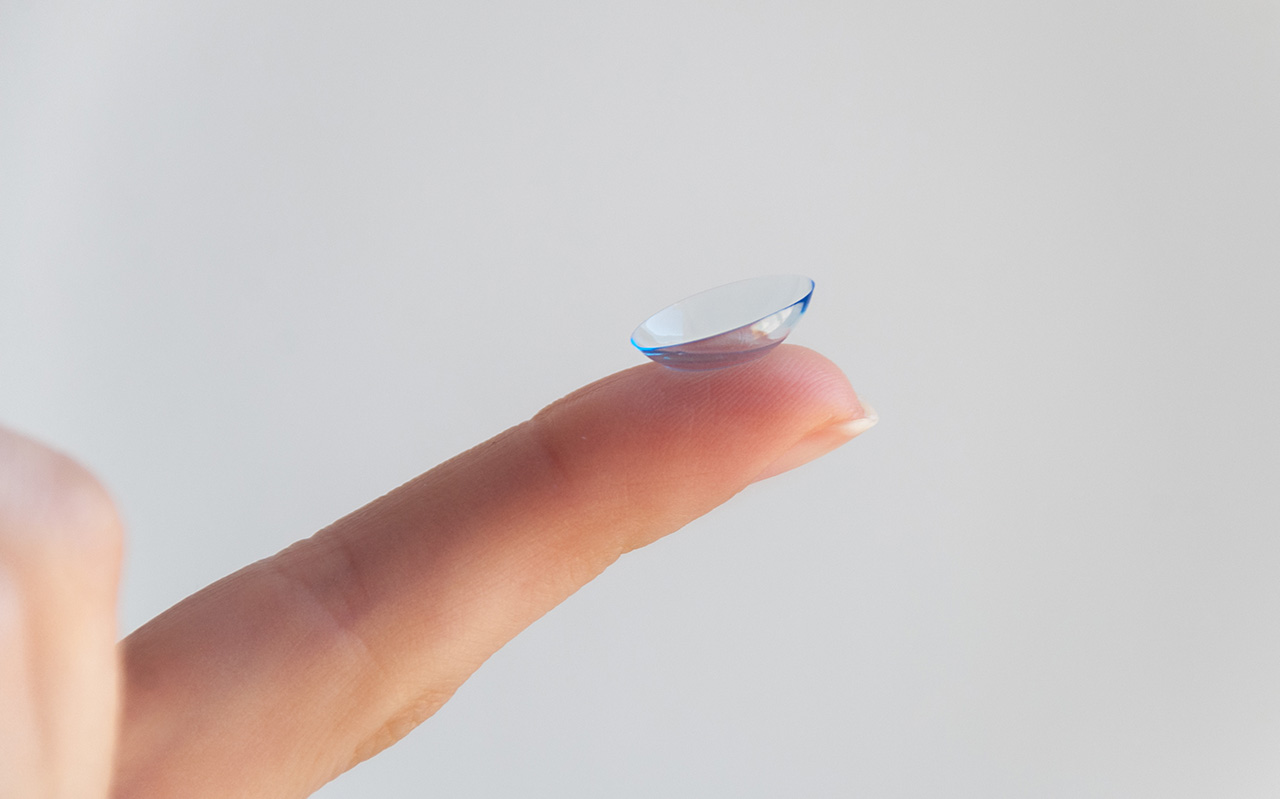 contact lens on tip of a finger